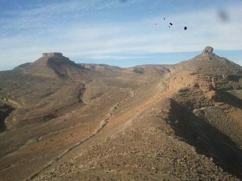 A photo of the Drotops quarry at Issoumour, Morocco.  The quarry following the horizon where this trilobites are found extends several kilometers around the mountain.